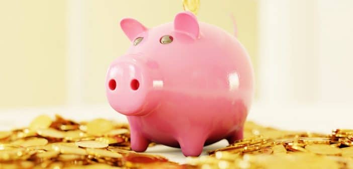 pink pig coin bank on brown wooden table