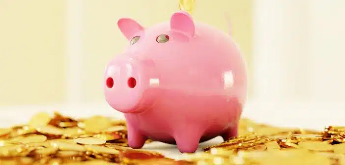 pink pig coin bank on brown wooden table